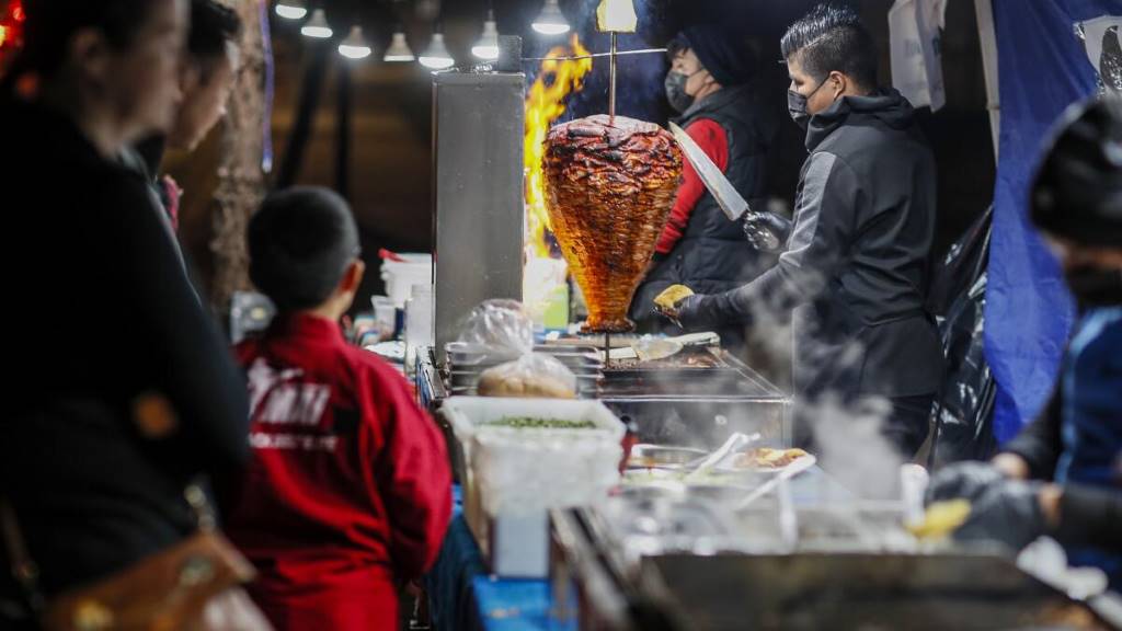 Vendor serving authentic Mexican tacos at the Ninth Avenue Food Festival in NYC