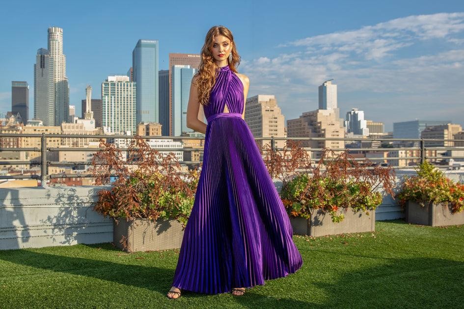 3. Guests shopping exclusive luxury beachwear during a rooftop fashion event in Manhattan