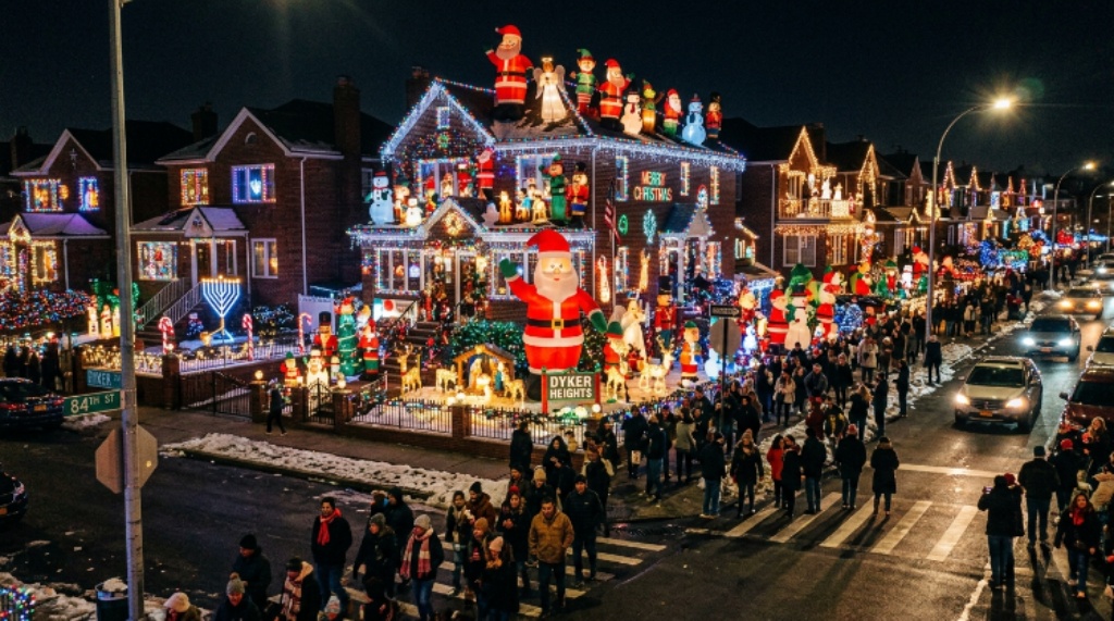 Rows of elaborately decorated private homes in Dyker Heights, Brooklyn, covered in thousands of Christmas lights, inflatable Santas, and festive displays during the 2026 holiday season in New York City